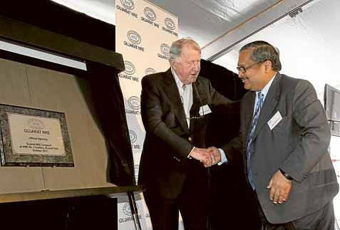 Former NSW premier Neville Wran (left) and Gujarat NRE executive chairman Arun Jagatramka unveil a plaque at the launch of the new $90 million longwall mining equipment yesterday. Picture: DAVE TEASE