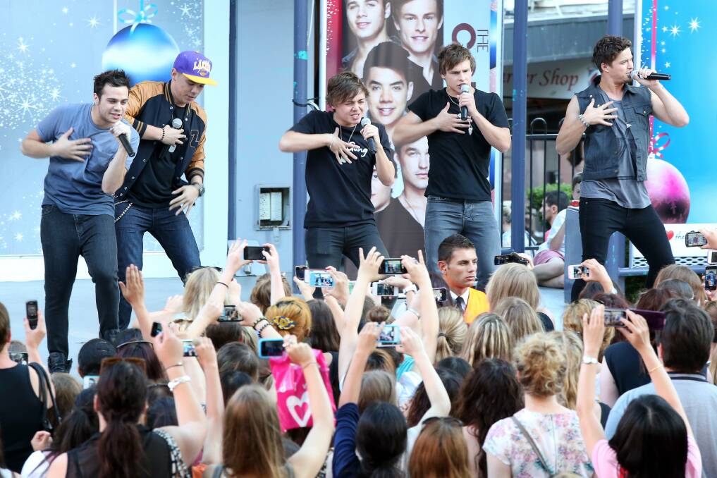 X Factor stars The Collective entertain fans at the mall yesterday.Picture: ADAM McLEAN