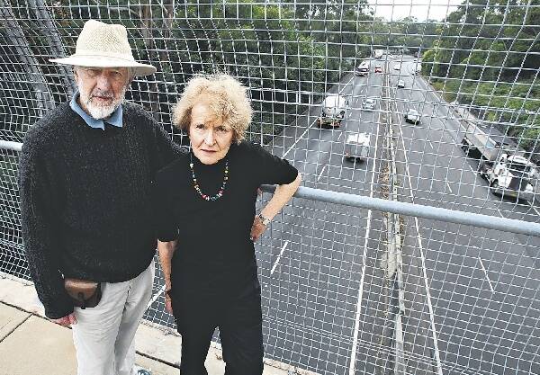 Keith Tognetti and wife Irene at the Mt Pleasant Rd overpass on Mt Ousley Rd. Picture: KEN ROBERTSON
