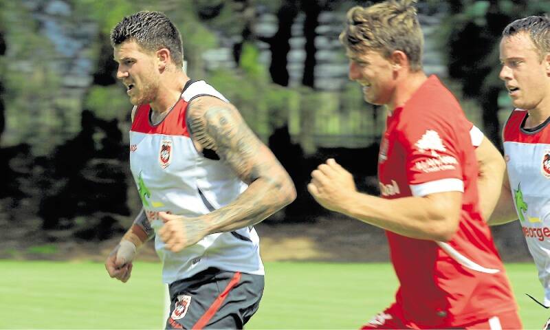 Josh Dugan (left) at training with teammates. The playmaker has added 5kg to his playing weight as he bulks up for the new season.Picture: ORLANDO CHIODO