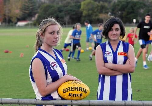Jessie Mulholland (left) and Madison Giffin at Figtree Oval yesterday. The two have been banned from junior games after turning 14 years old. Picture: MELANIE RUSSELL