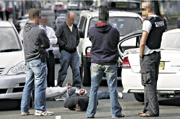The scene in Wollongong's CBD after police swooped on a suspect car on Thursday. Two men have been charged with firearm and drug offences.