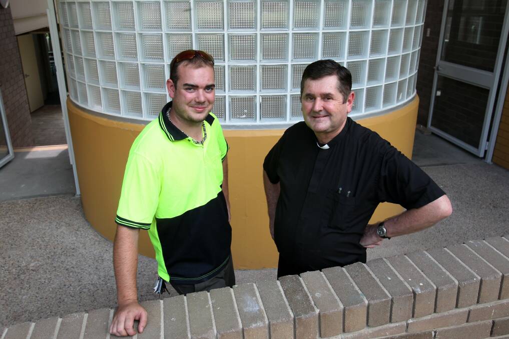 Father Chris Riley (right) with maintenance man Corin Newcombe at the opening. Picture: GREG TOTMAN