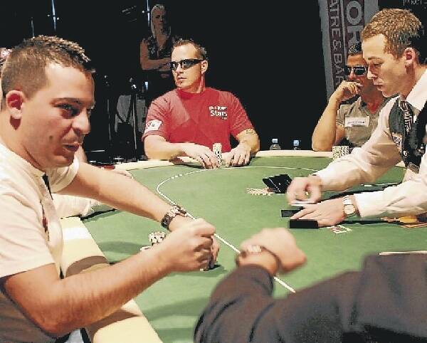 Aaron Benton (centre) studies the play during the Australian Pacific Poker grand final at Star City Casino last weekend.