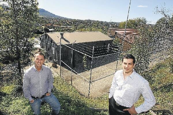 Andrew Harrison (right) and brother-in-law George Nicolaou at the Keelong site at Cordeaux Heights (below), bought for $2.75 million. Picture: KIRK GILMOUR