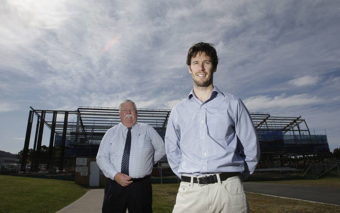 Innovation Campus director david Campbell and project manager Lance Jeffery in front of the UOW site. Picture: ANDY ZAKELI