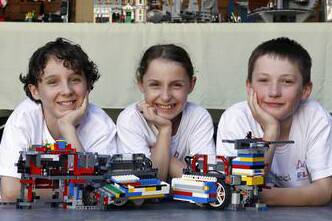 Elliot Boswell, 12, Jemima Boswell, 10, and Isaac Clark, 11, of Project Bucephalus with their Lego robots. Picture: ANDY ZAKELI