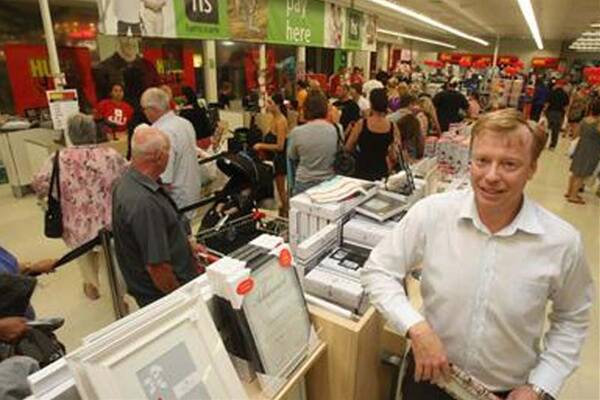 A happy Harris Scarfe regional manager Andrew Cornford with shoppers at Stockland Shellharbour. Picture: ROBERT PEET