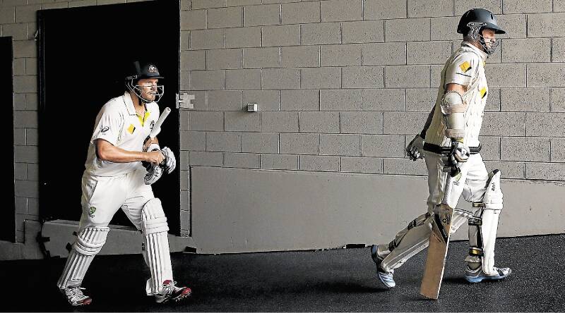 Padded: Shane Watson of Australia, left, and Chris Rogers walk out on day four of the Fourth Ashes Test in Melbourne.Picture: GETTY IMAGES