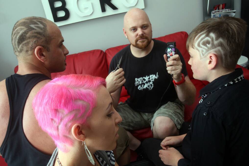 Daniel Talevski, Caitlyn Page and Josh Short compare hair tattoos with Kevin Crane. Picture: ROBERT PEET