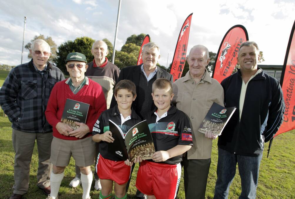 Norm Jarvis, second from right, with Barry Ross, right, who wrote the Corrimal Cougars’ centenary book A Long Time Between Drinks.