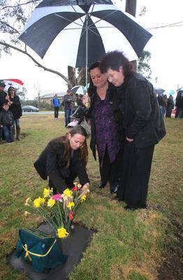 Angela, Sharon and Eileen Giffard at the memorial plaque. Picture: ROBERT PEET