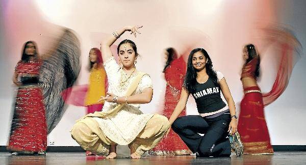 St Mary Star of the Sea student Heema Vyas (left) and Shiamak Indo Jazz Studio choreographer Dipti go through their routine with other dancers. Picture: KEN ROBERTSON