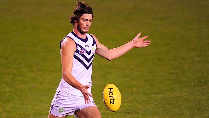 Dylan Roberton gets a kick away from Fremantle in July.