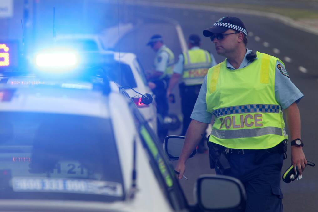 Holiday check: Lake Illawarra highway patrol officers conduct breath tests at Shell Cove yesterday as part of Operation Safe Arrival.Picture: GREG TOTMAN