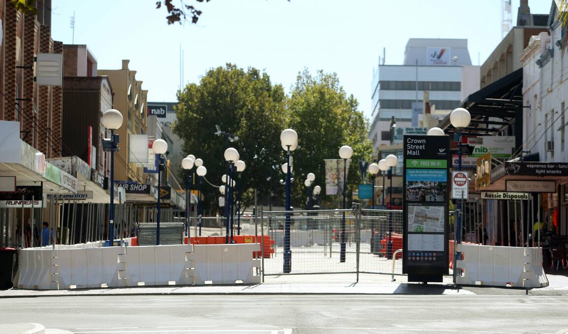 Wollongong City Council has started installing hoarding at the lower end of Crown Street Mall in preparation for the final stage of works. Picture: ROBERT PEET