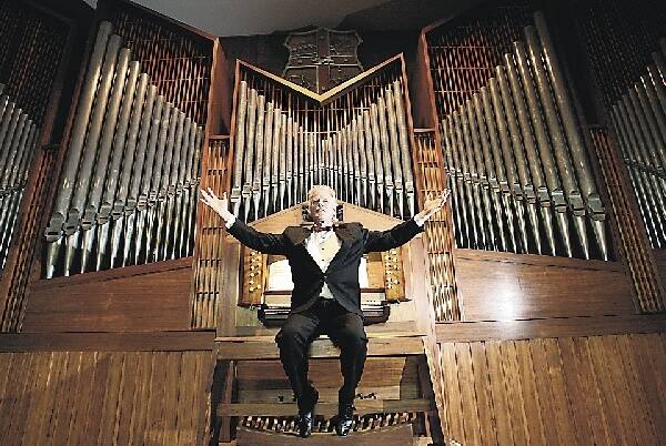 Sydney City organist Robert Ampt performed to a packed audience yesterday at Wollongong Town Hall, which was saved from demolition. Picture: KEN ROBERTSON