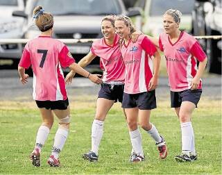 Jordan Baker, second from right, celebrates scoring a goal with her teammates. Picture: ANDY ZAKELI