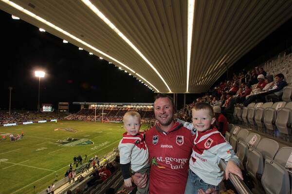 Justin Timmins, brother of Dragons legend Shaun Timmins, with sons Kobi and Zane in the western grandstand  last night to  support St George Illawarra.  Picture: ADAM McLEAN 