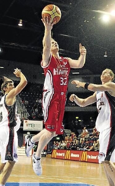 Wollongong Hawks captain Mat Campbell lays up during the game against Perth on Friday night. Picture: ROBERT PEET