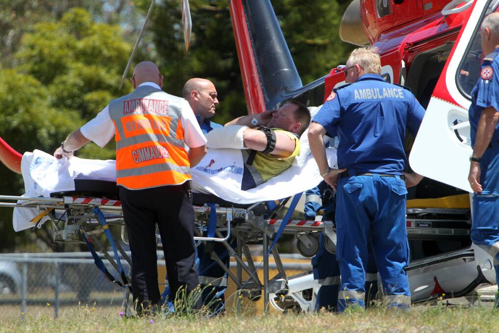 A rescue chopper picks up the injured man from Shellharbour Hospital. Picture: GREG TOTMAN