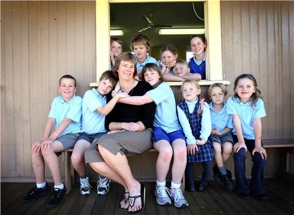 Public School Parent of the Year Joanne Chilton with Coledale Public School students Zebedee Lilliendal (left), son Liam and daughter Ashleigh, Jemma Metcalfe, Ben Cahill and Alex Keers. Back: Bear Oliver, Samuel Nakkan, Sascha Macgeorge, Kaimana Fittock and Luca Seresin-Staig. Picture: SYLVIA LIBER