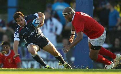 Rebel fighter ... Danny Cipriani, the Melbourne Rebels' English import, runs with ball in a trial match against Tonga.