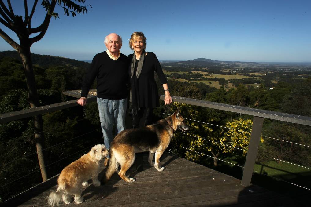 Mr Barker and his wife, Penny, with their dogs.