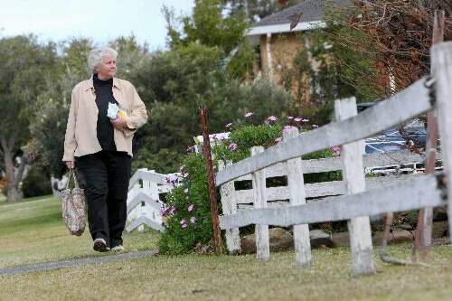 Liberal MP Joanna Gash goes door-to-door in Barrack Heights yesterday.