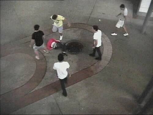Rhys Williams (yellow shirt) and Brett Mitchell (black shirt) are seen in a still image taken from CCTV footage of the assault in Crown St Mall earlier this year.