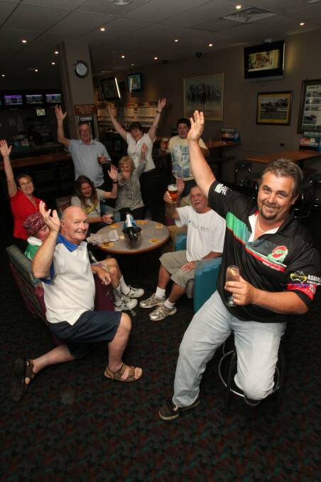 Paul Balfour and club regulars celebrate. Picture: GREG TOTMAN