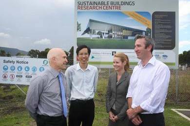 UOW’s Professor Paul Cooper (left) and Dr Zhenjun Ma  with BlueScope’s  Dr Troy Coyle  and  Dr Rob Scott outside the Sustainable Buildings Research Centre, which will be the focus of new solar technology. Picture: MELANIE RUSSELL