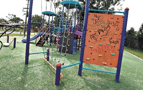 Graffiti on play equipment at Lindsay Maynes Park in Unanderra. Picture: ORLANDO CHIODO