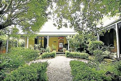 An Illawarra family has bought the historic dwelling, which was originally the home of a church minister and has also been a doctor's surgery, a gallery and museum.