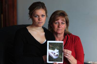 Jessica and Cathy Wagner with a photo of their Maltese terrier Teddy. Picture: GREG TOTMAN