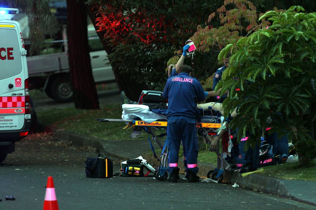 Ambulance workers at the scene after Darko Janceski was gunned down outside his parents’ home. 