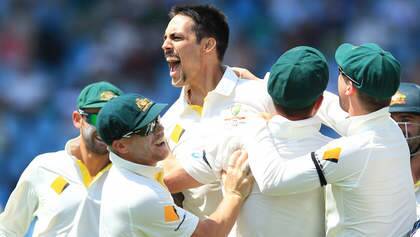Mitchell Johnson, centre, celebrates with teammates after dismissing South Africa's captain Graeme Smith. Photo: AP Photo