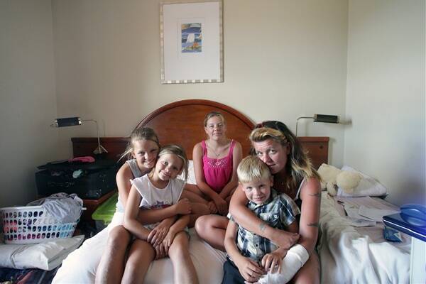 Emily, 11, Tiarnah, 6, Chloe, 15, Joshua, 7, with mum Jane Watts inside the rented room  at Berkeley Hotel as they struggle to find a place to rent.  Picture: ADAM McLEAN
