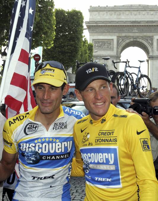 Lance Armstrong with team mate George Hincapie after taking his seventh straight Tour de France. Picture: REUTERS