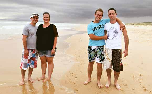 Couples Trevor and Denise Gaskell and Peter Bearman and James Pollack on Port Kembla beach yesterday. Picture: SYLVIA LIBER