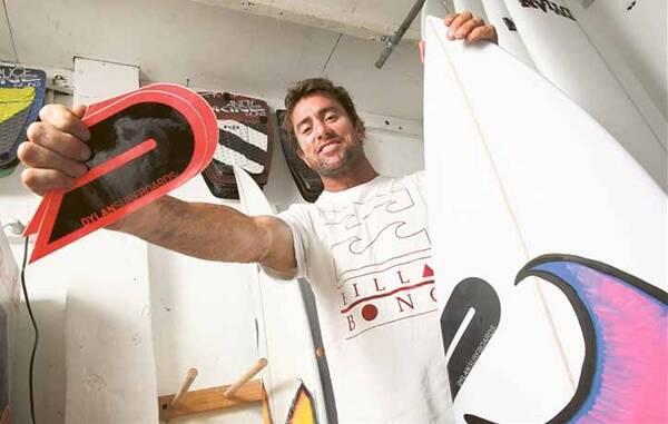 Dylan Longbottom at his surf shop. His ride in Tahiti put him in line for an award. Picture: DAVE TEASE