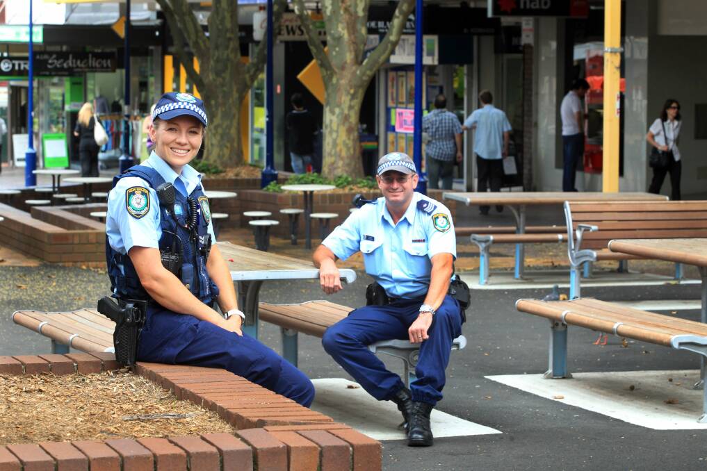 Sergeant Bob Minns and Senior Constable Jess Kelly take a breather ahead of an expo to raise money for the family of Detective Inspector Bryson Anderson. Picture: ORLANDO CHIODO