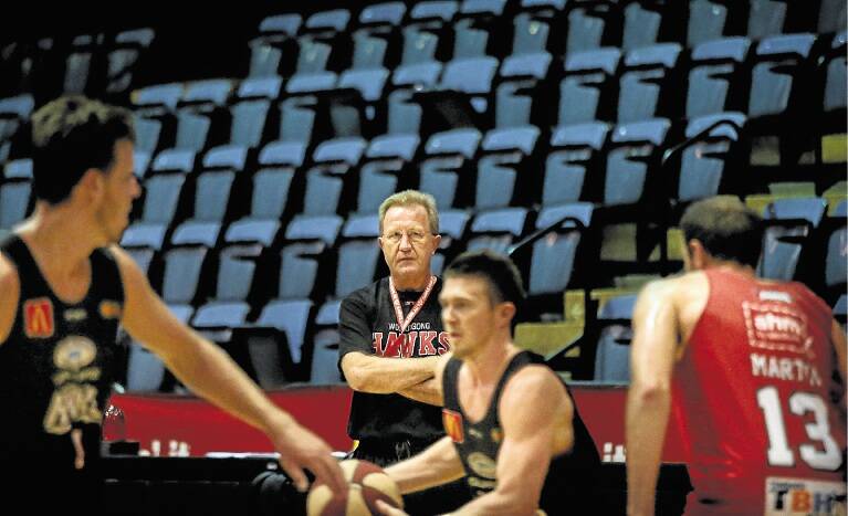 Wollongong coach Gordie McLeod keeps a close watch on his players at training on Monday. Picture: ADAM McLEAN