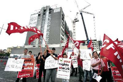 Construction workers stage a protest outside the construction site in Wollongong yesterday. Picture: SYLVIA LIBER