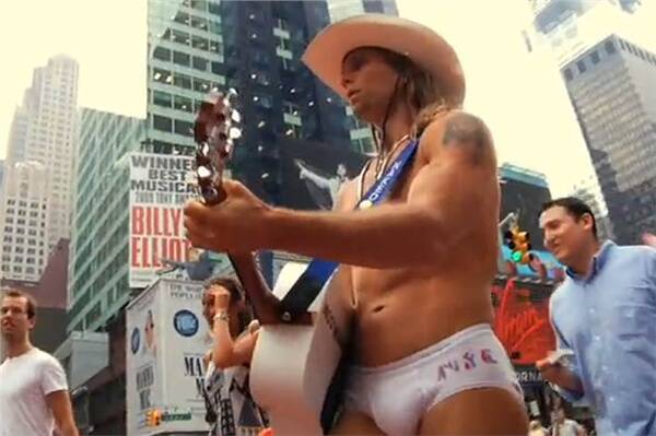 The Nake Cowboy busking in Times Square.