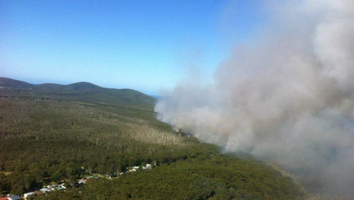 Smoke from the Janies Corner bush fire, near Forster in NSW. Photo: NSW RFS