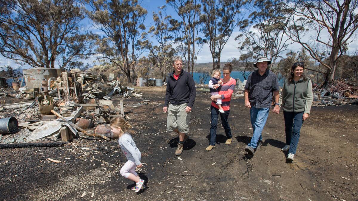 Tammy and Tim Holmes and family at their property near Dunalley. Photo: PETER MATHEW