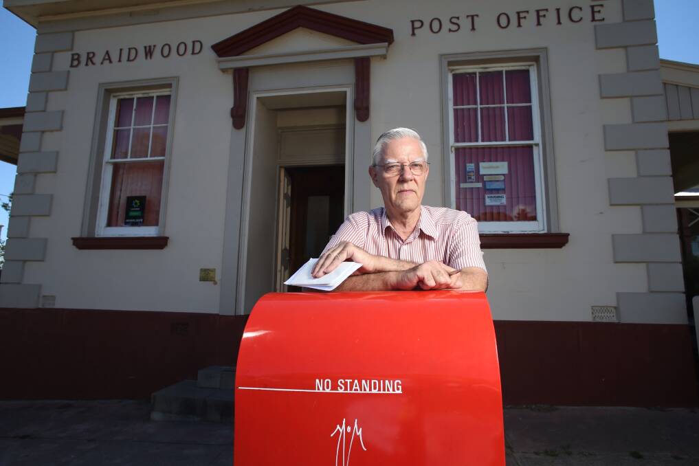 Small town hub: Bruce Keeley at Braidwood Post Office, which he has run for 16 years. Picture ANDREW MEARES