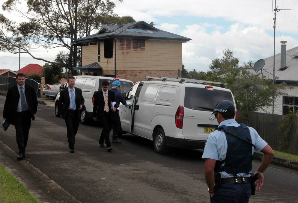 Detectives at the Corrimal house fire. Picture: KIRK GILMOUR