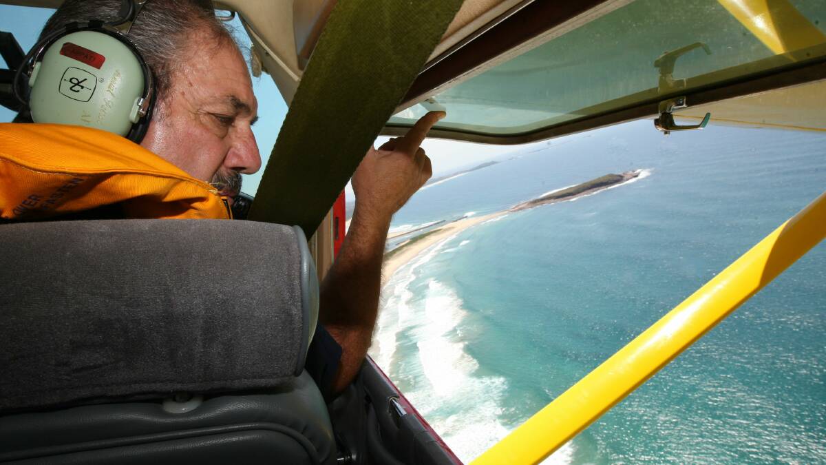 Harry Mitchell patrols for sharks in the Bendigo Bank Aerial Patrol. Picture PETER HAWKINS